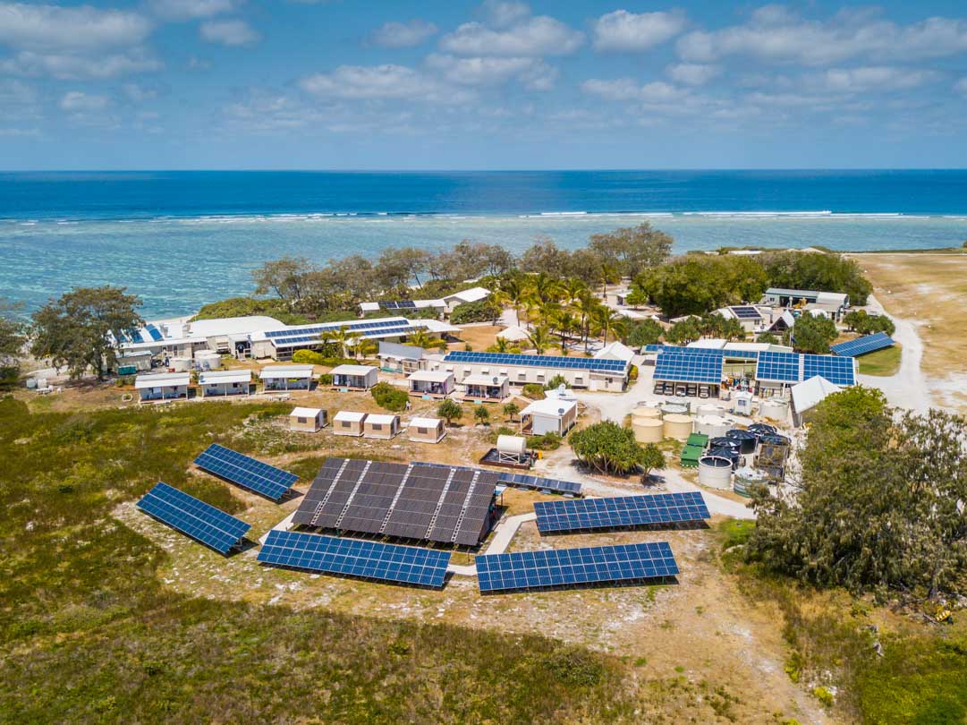 An aerial shot of Lady Elliott Eco Resort where you can see the buildings and the extensive solar panels they have to make their own power off the grid