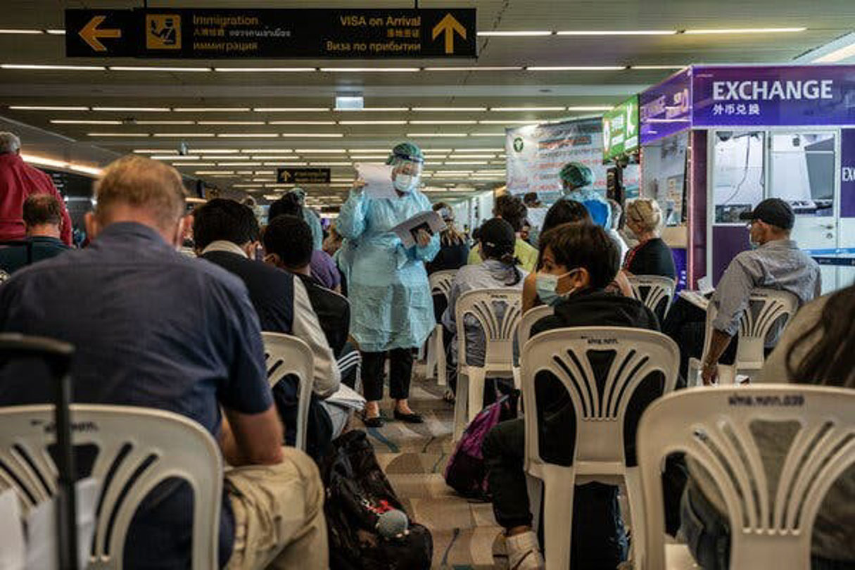 Passengers waiting at the arrival area to be screened on arrival to Phuket, Thailand.